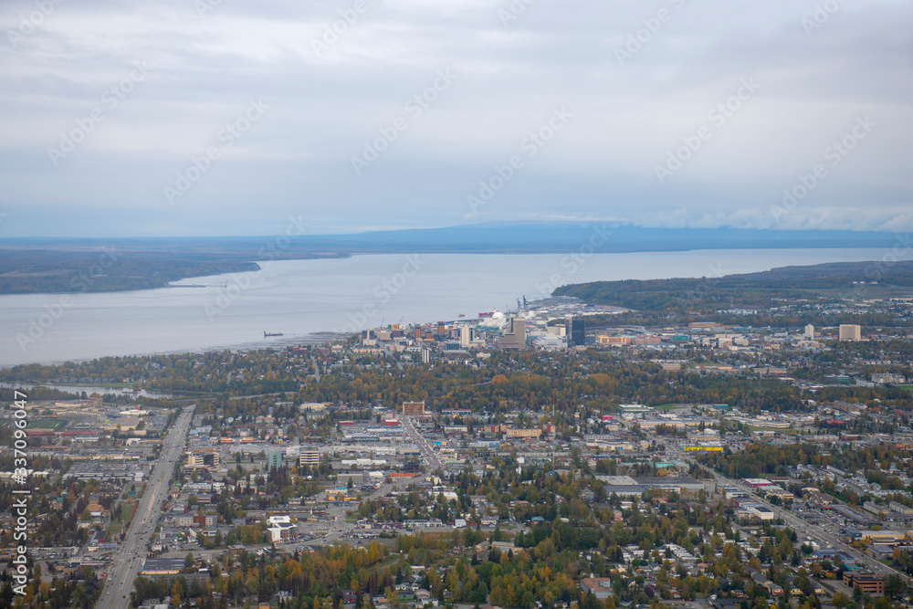 Aerial view of downtown Anchorage and Port on Knik Arm from a taking off airplane in Anchorage, Alaska, AK, USA.