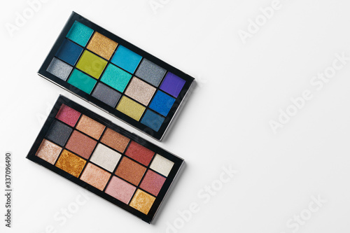 Make up colorful eyeshadow palettes isolated on white  top view