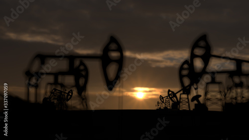 The silhouette of oil pumps in a large oil field at sunrise. 3d rendering. 3d illustration