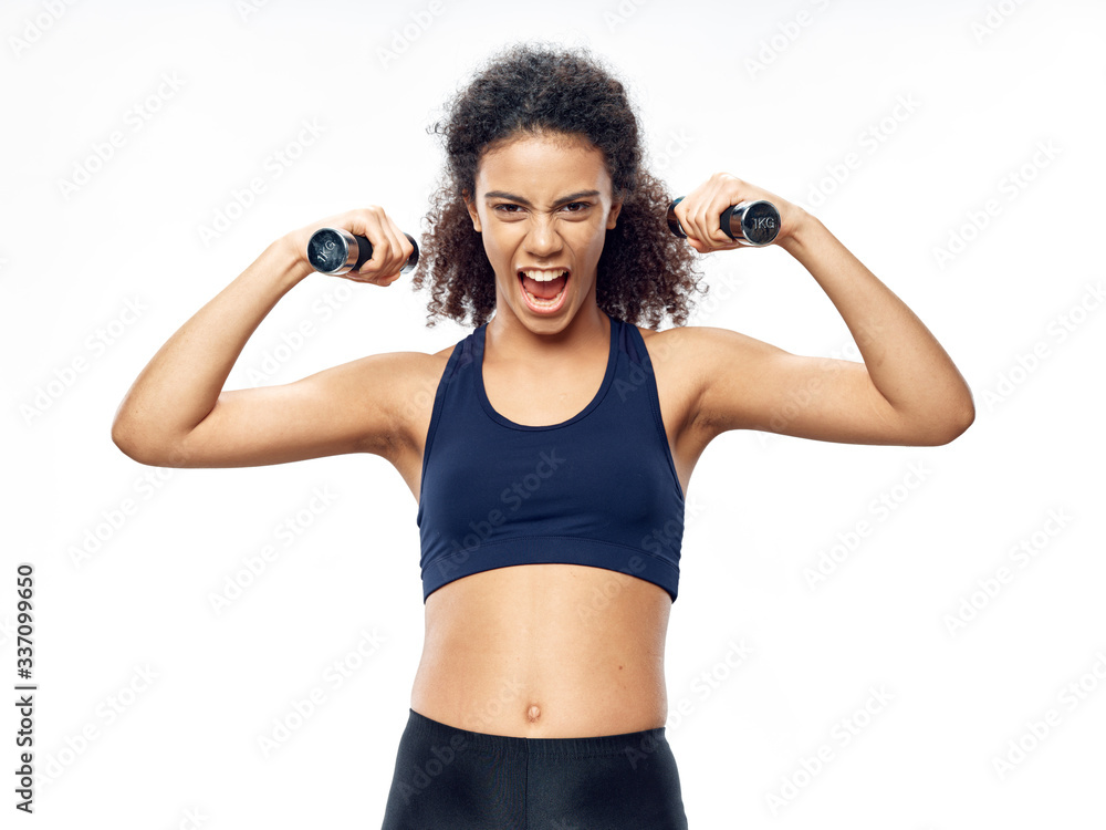 young woman exercising with dumbbells young woman exercising with dumbbells