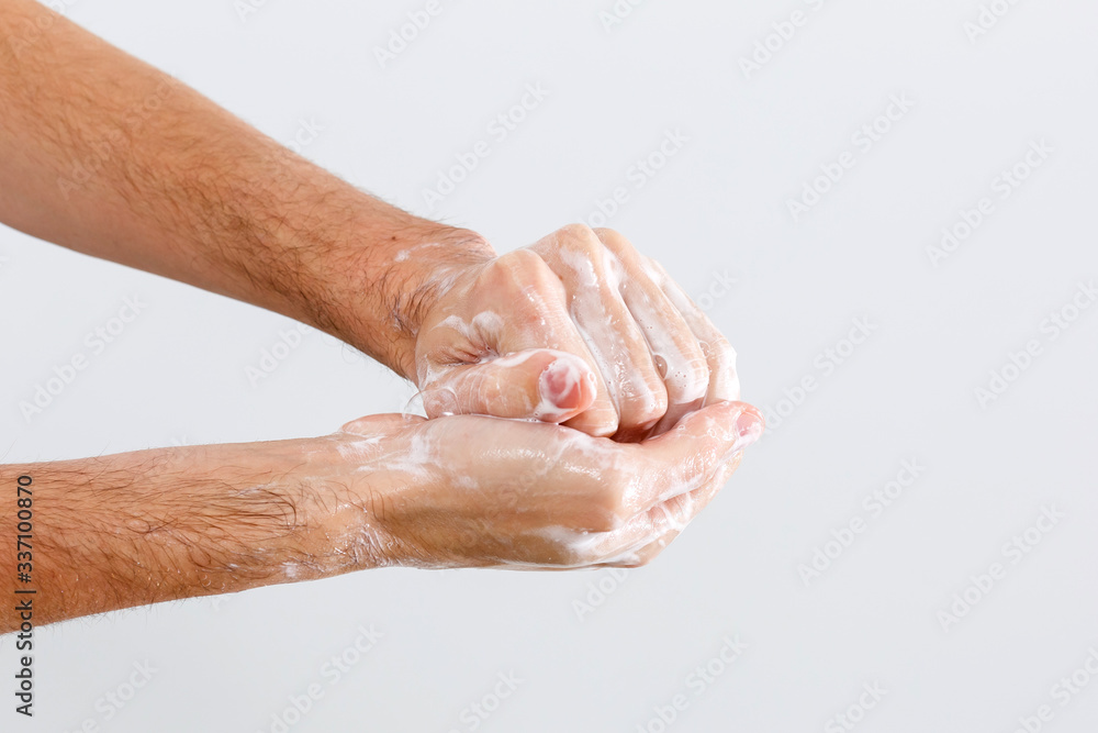 Fototapeta premium Close up image of washing hand against white background