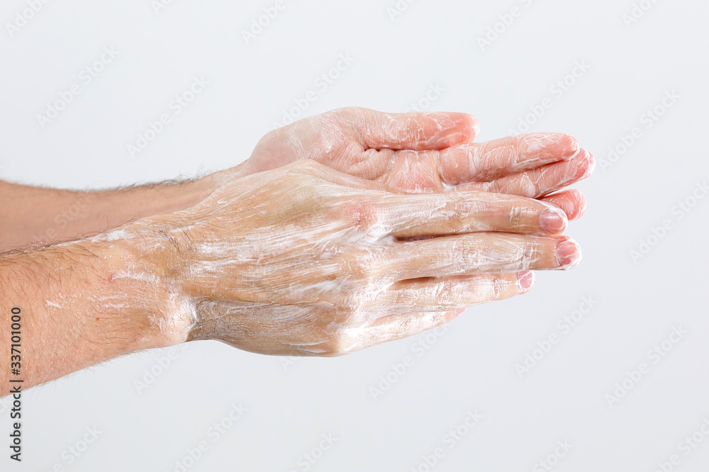 Close up image of washing hand against white background Close up image of washing hand against white background