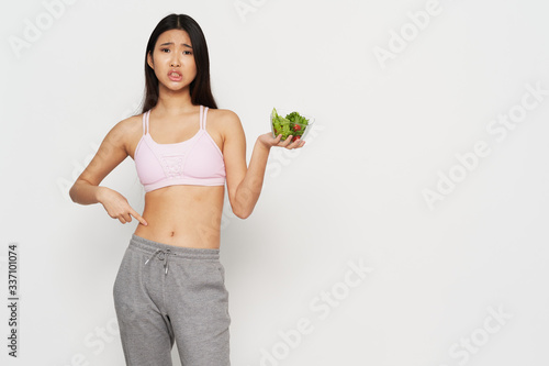 young woman holding a healthy food © SHOTPRIME STUDIO