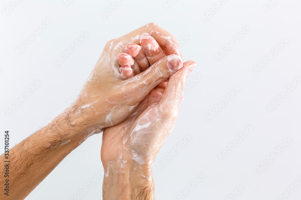 Fototapeta premium Close up image of washing hand against white background