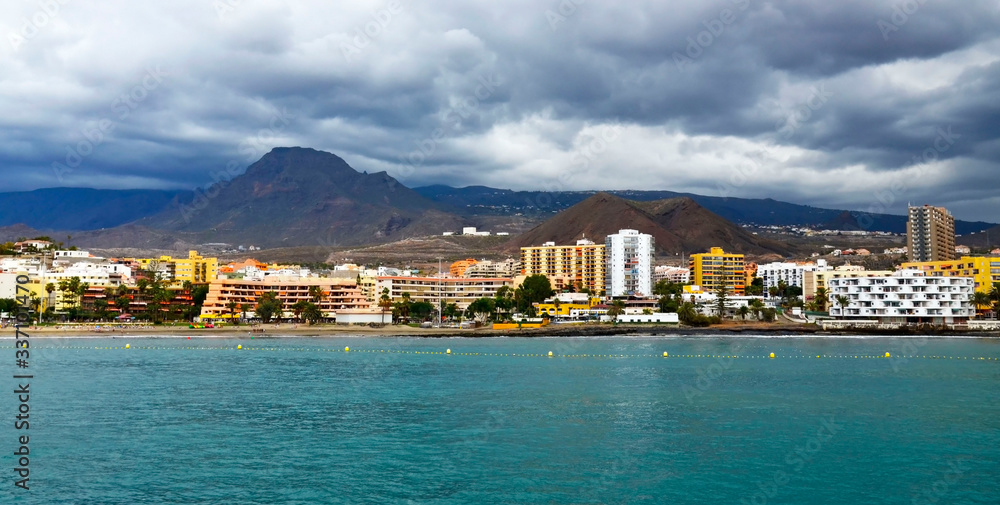 Panorama view of Los Cristianos coastline on a cloudy day in Tenerife,Canary Islands,Spain. Travel or vacation concept.