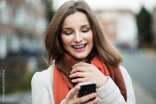 Happy woman texting. Good news
