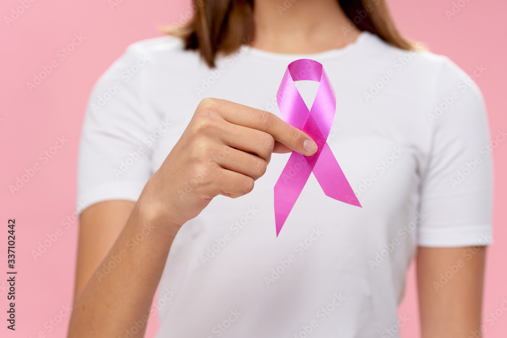 pregnant woman holding pink ribbon pregnant woman holding pink ribbon