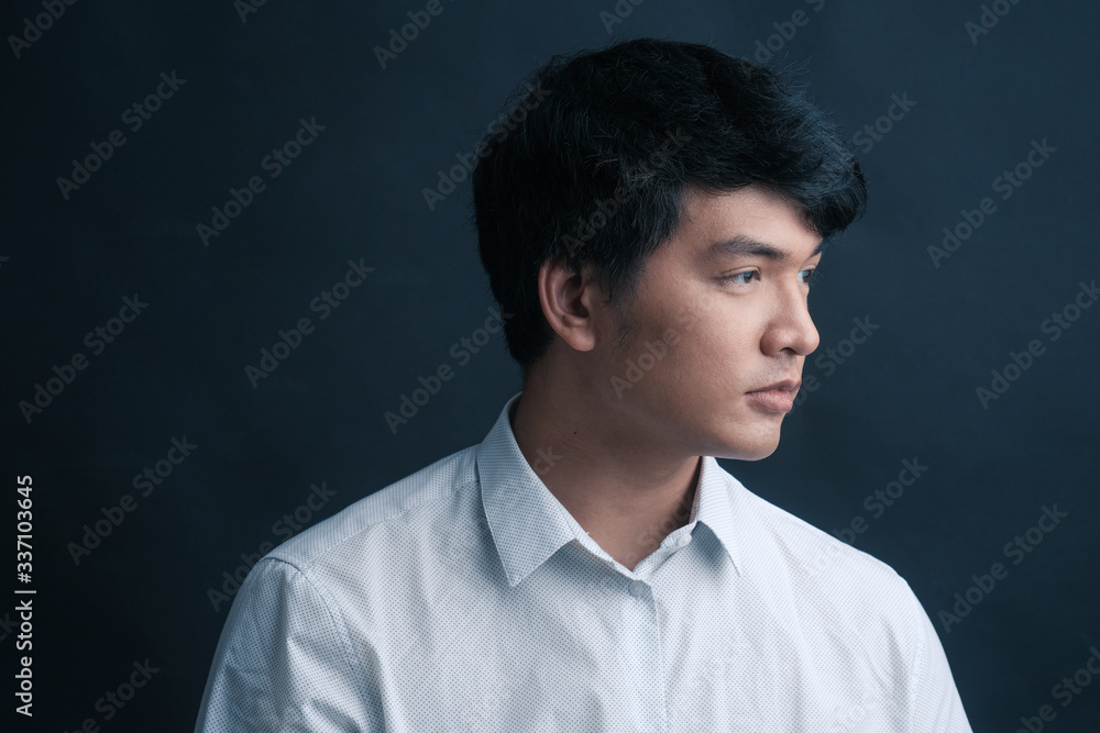 Studio portrait of Asian man on black background Studio portrait of Asian man on black background