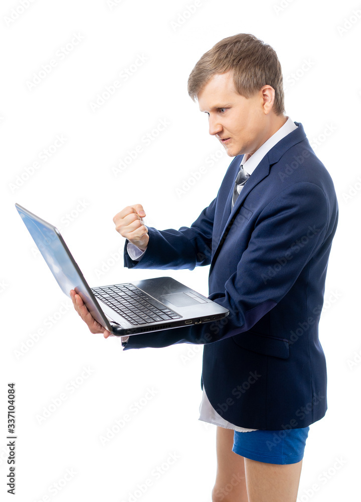 A young businessman leads an online meeting at a computer in his underpants. Stay at home while quarantined while the world is in pandemic or epidemic of the virus. Isolated on a white background. A young businessman leads an online meeting at a computer in his underpants. Stay at home while quarantined while the world is in pandemic or epidemic of the virus. Isolated on a white background.