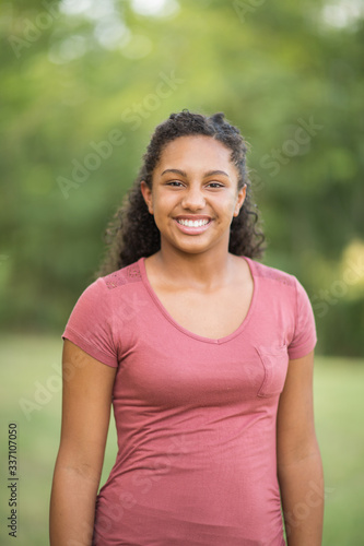 Young happy teen girl laughing and smiling.