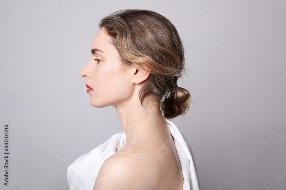 Beauty side portrait of young woman with red lips. Close-up portrait. Beauty side portrait of young woman with red lips. Close-up portrait.