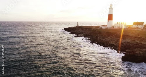 Aerial, sunset behind Portland Bill Lighthouse