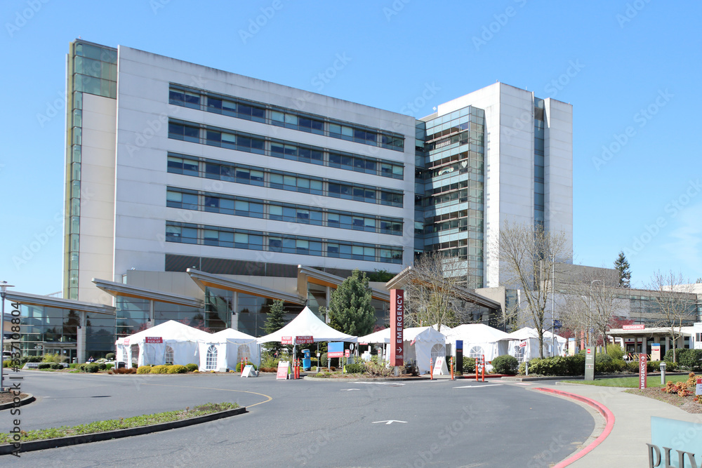 External hospital tents on hospital property, preparing for in-coming patients during a pandemic.
