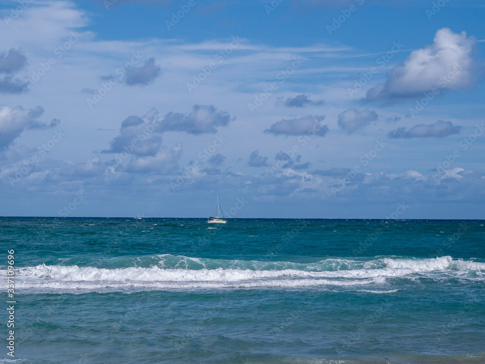ocean with boat in the distance
