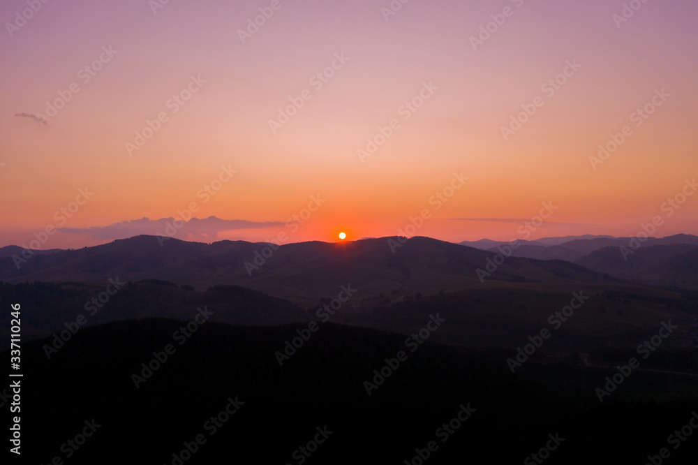 Beautiful sunrise in the mountain landscape. Amazing sky
