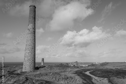 Landscape photo of disused industrial chimneys from the mining industry on the Cornish coast photo