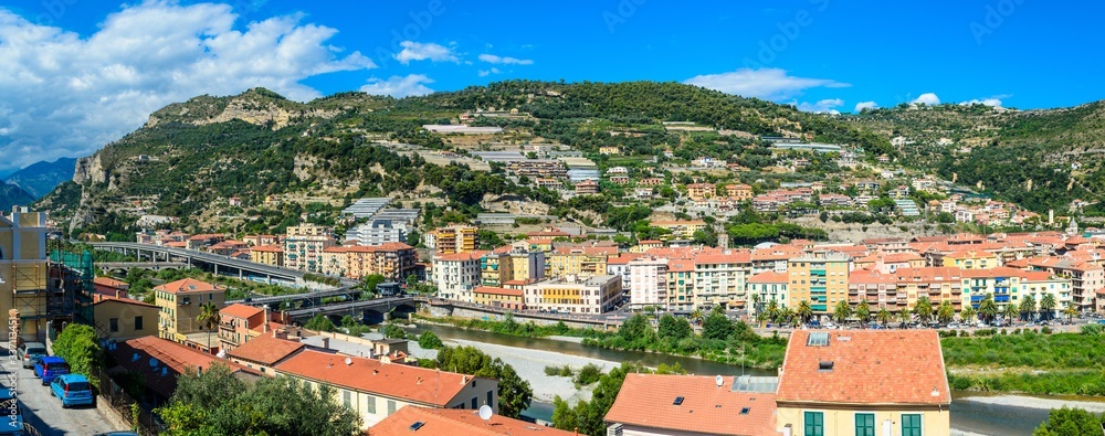Ventimiglia town, Italy. View on the city, mountains with blue sky, italian riviera. Border with France, Cote de Azur