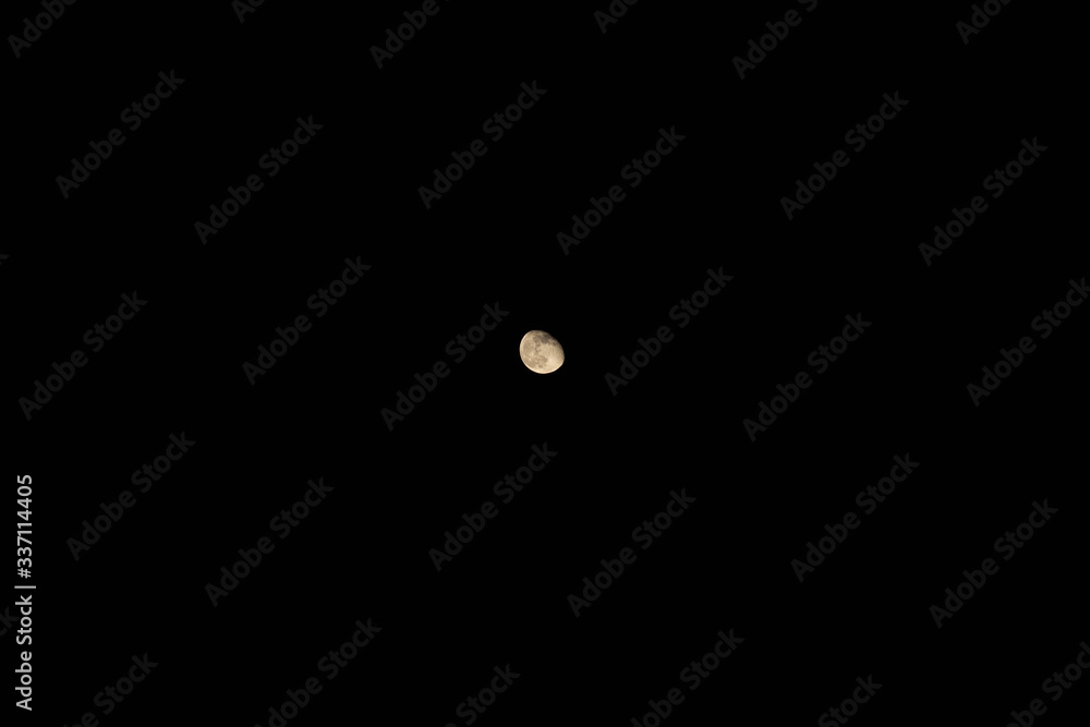View of small waning moon in cloudless sky at dark summer night. Background, postcard, copy space. Idea concept View of small waning moon in cloudless sky at dark summer night. Background, postcard, copy space. Idea concept