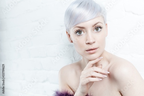 Obraz na plátne Close-up portrait of beautiful young woman with white hair, looking at camera