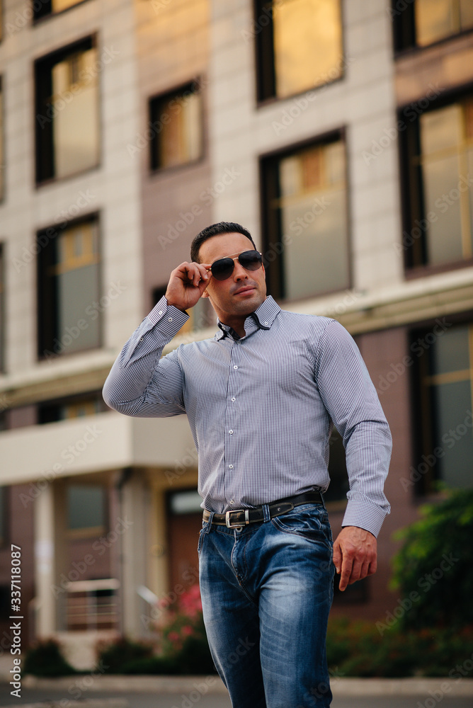 Young successful man near an office building. Business Young successful man near an office building. Business