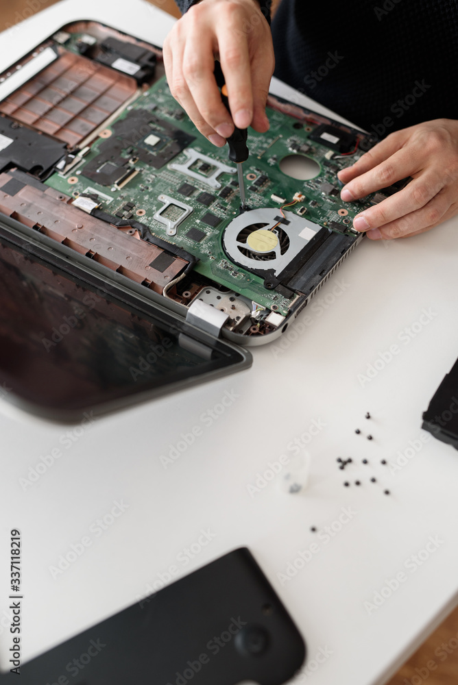 Laptop repair. Disassembled computer parts. PC electronic components. Closeup of keyboard, hdd, motherboard cpu Laptop repair. Disassembled computer parts. PC electronic components. Closeup of keyboard, hdd, motherboard cpu