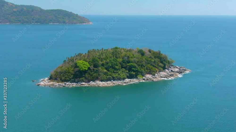 A small tropical island with a coral reef A small tropical island with a coral reef