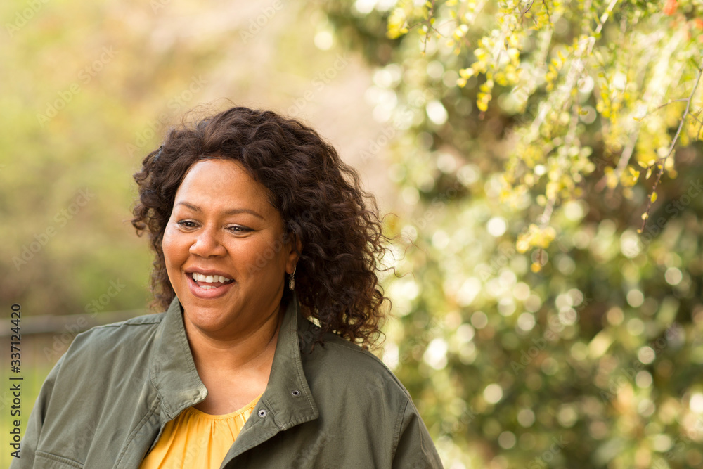 Beautiful mature African American woman smiling and laughing. Beautiful mature African American woman smiling and laughing.