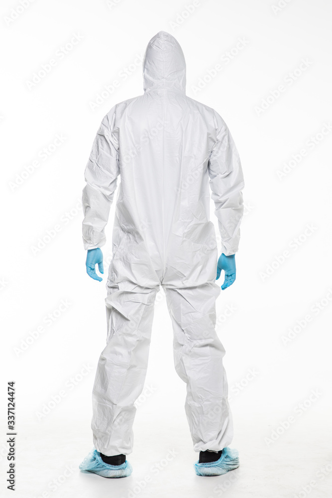 Rear view of Young man in chemical protective suit making stop gesture on white background. Virus research Rear view of Young man in chemical protective suit making stop gesture on white background. Virus research