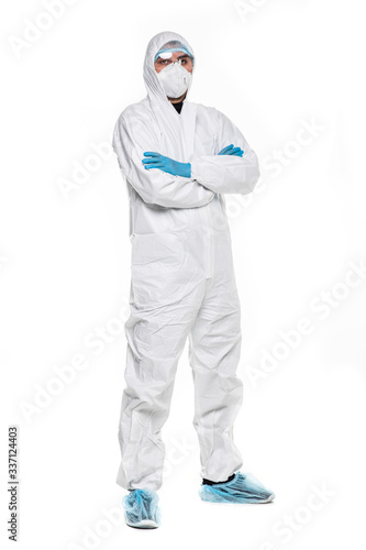 Photography Young man in chemical protective suit making stop gesture on white background