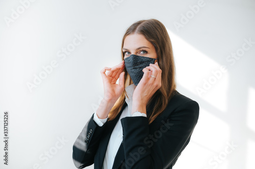 successful business woman putting on a breathing mask