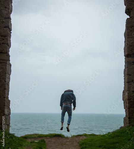 Model levitating near ocean