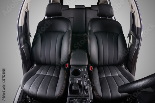 the interior of the car is covered with handmade genuine leather.  View from the windshield. The back doors are cut from the photo. High-quality stitching © Sasha