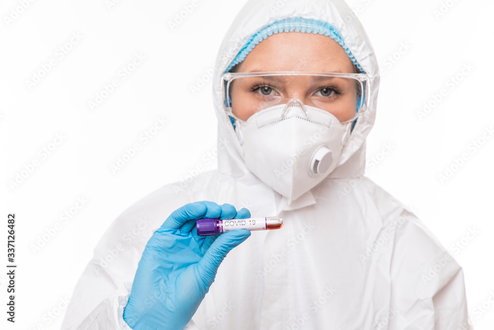 Female doctor with a sample blood test tube of Covid-19. Coronavirus concept Female doctor with a sample blood test tube of Covid-19. Coronavirus concept