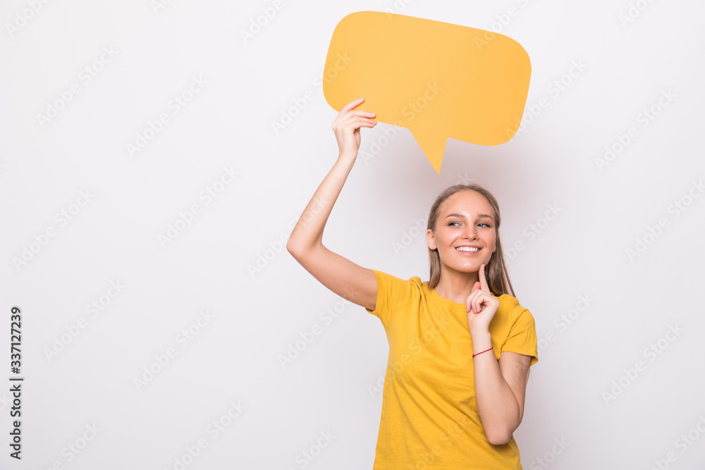 Young beautiful girl holding a orange bubble for text, isolated on a white background Young beautiful girl holding a orange bubble for text, isolated on a white background
