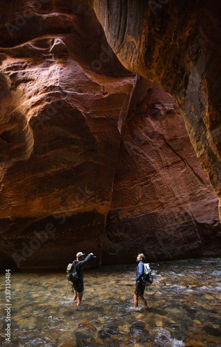 photographers in the river in Narrows, Zion UT