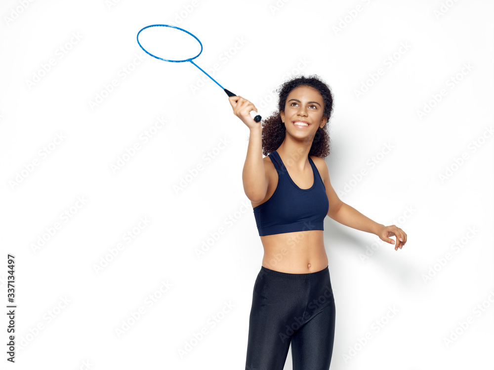 young woman with badminton racket young woman with badminton racket