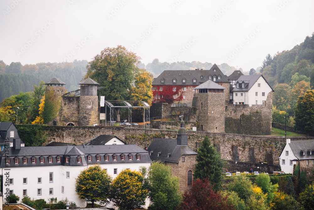 view of the city of Monschau and the castle from the top of a hill, Germany