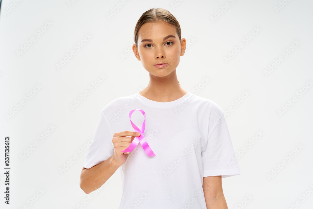 young female doctor holding a stethoscope young female doctor holding a stethoscope