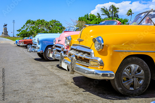 Havana Cuba Yellow collaection vintage classic american car in a typical with sunny blue sky 