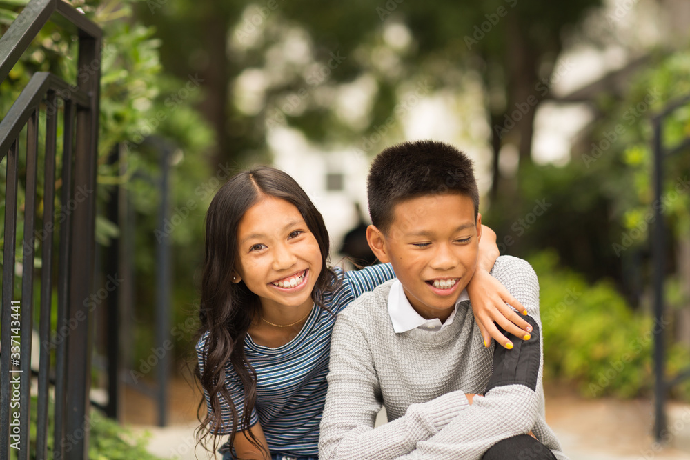 Portrait of an Asian brother and his little sister. Portrait of an Asian brother and his little sister.