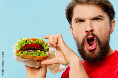 man eating a hamburger