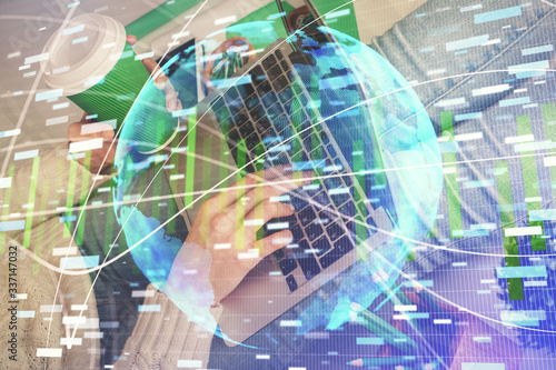 Double exposure of woman hands typing on computer and business theme hologram drawing. Success concept.