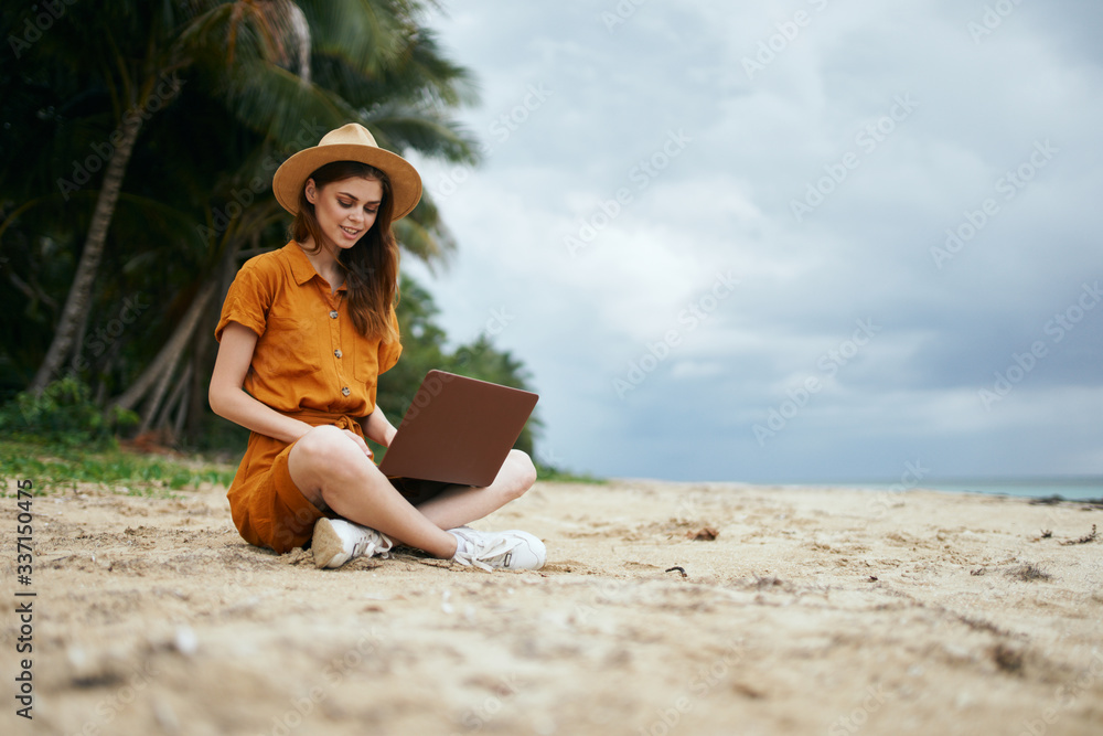 young woman sitting on the beach