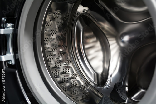 Inside a black washing machine. Inverter drum close up.