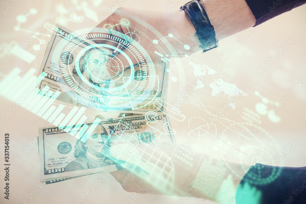 Multi exposure of financial theme drawing hologram and USA dollars bills and man hands. Business concept. Multi exposure of financial theme drawing hologram and USA dollars bills and man hands. Business concept.
