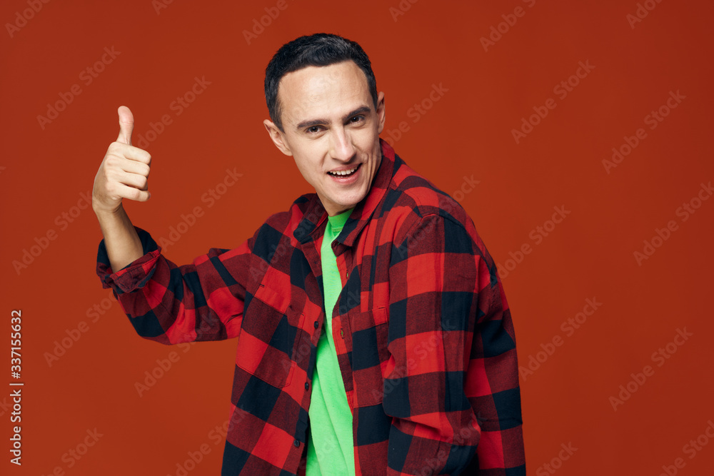 handsome young man showing thumbs up handsome young man showing thumbs up