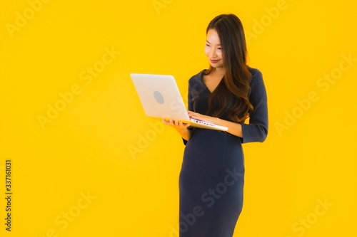 Portrait beautiful young asian woman with laptop