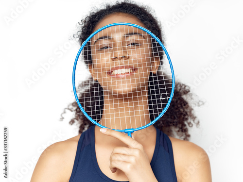 young woman with badminton racket