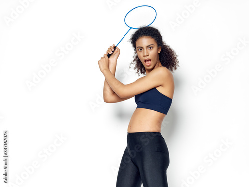 young woman with tennis racket
