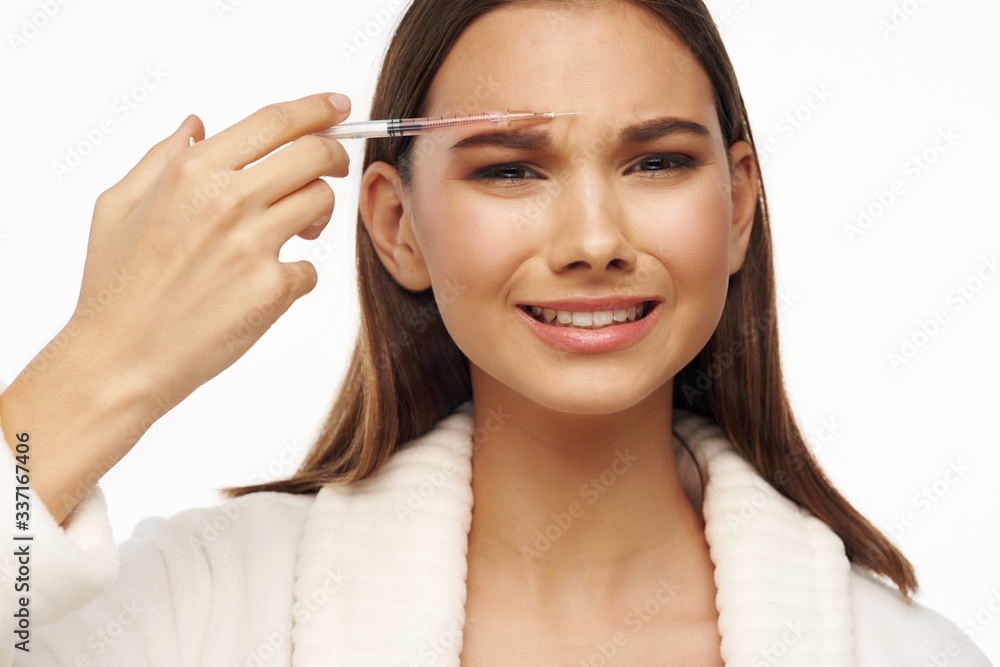 woman applying mascara woman applying mascara